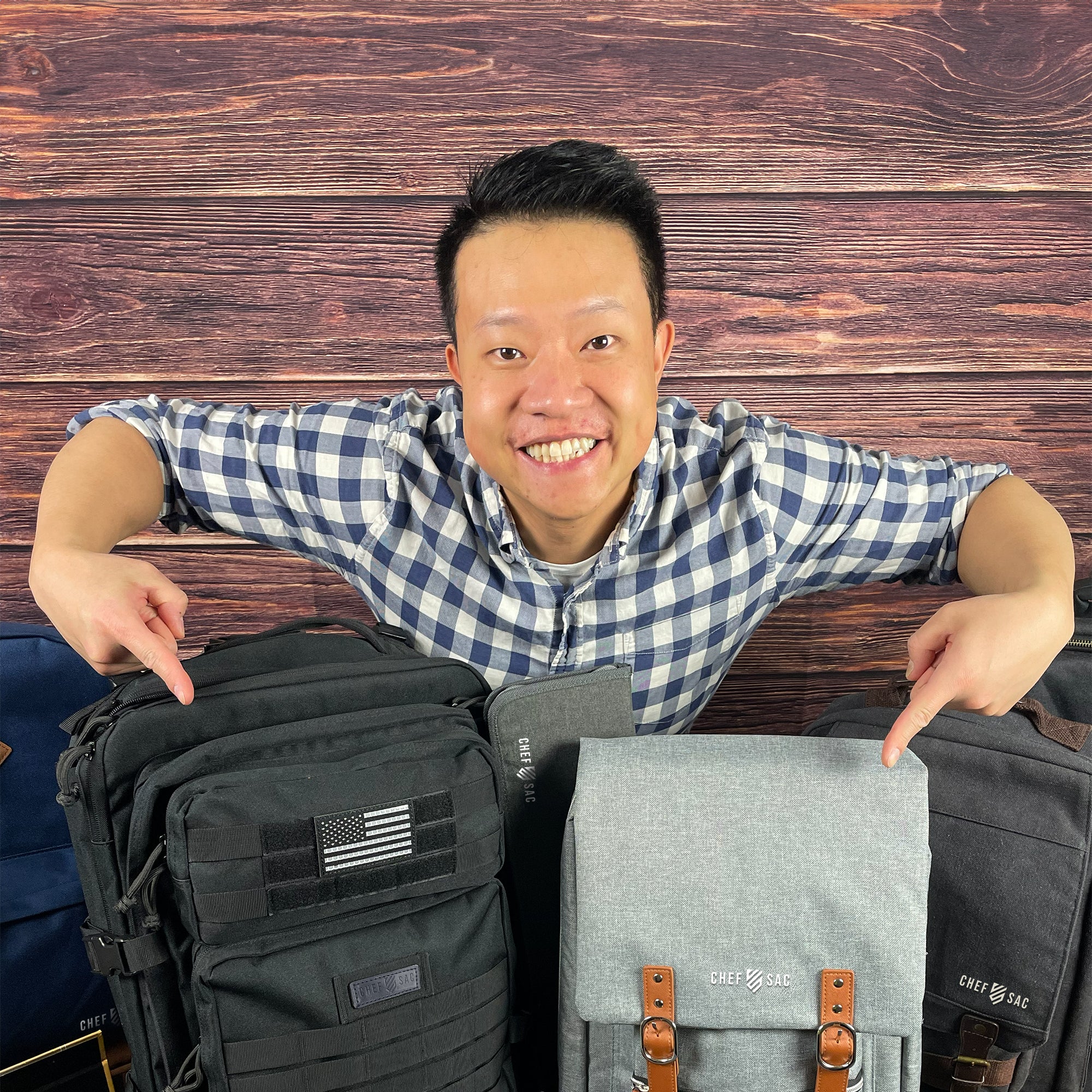 chefsac-founder-keith-chiu-pointing-at-chef-backpacks.webp
